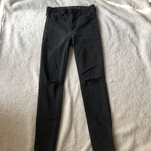 Black high rise ripped knee skinny jeans AEO